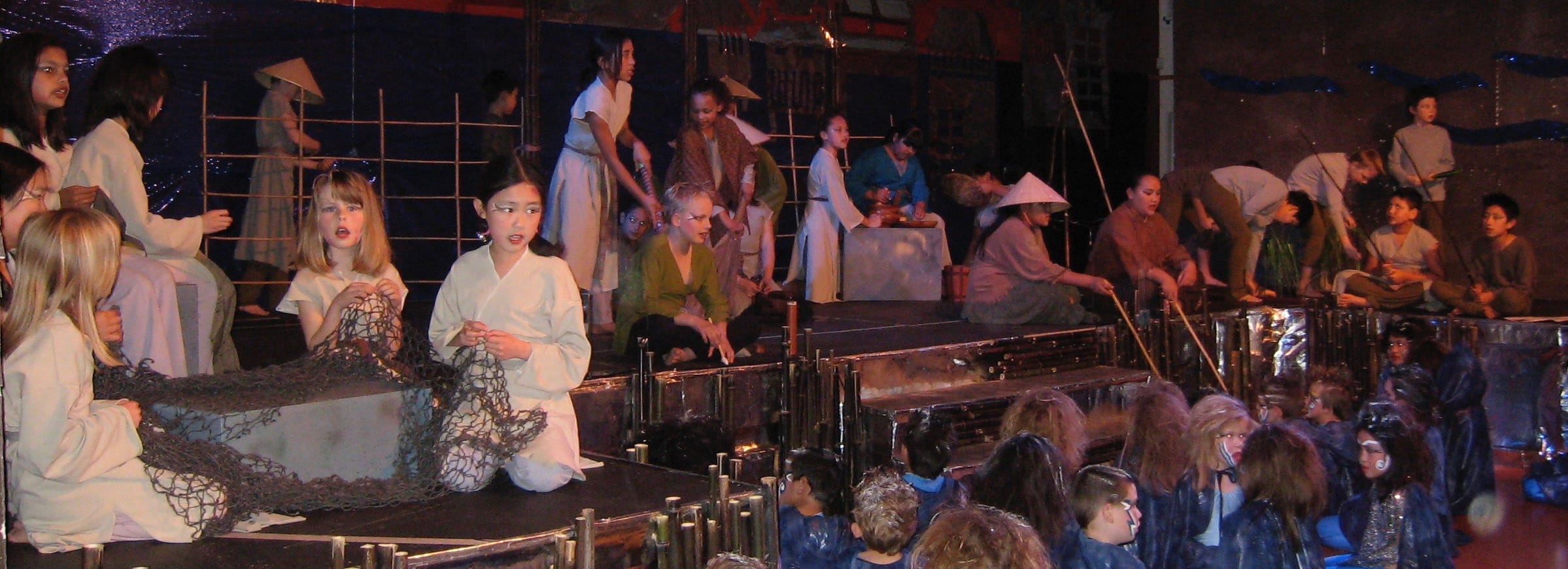 Villagers working at their daily chores, such as fishing and mending nets