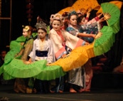 Fan dancers make a circle of fans