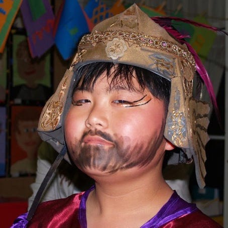 General Ho in gold helmet and make-up beard